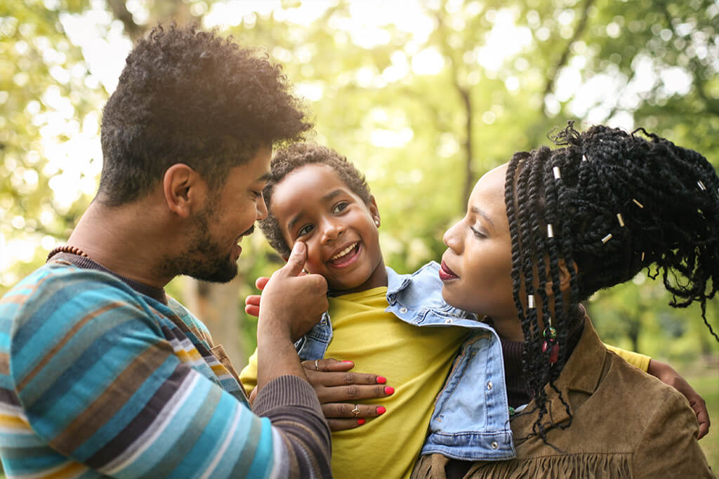 A happy family enjoying a walk in the park