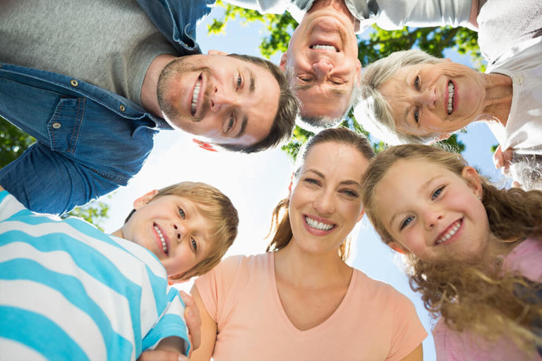 A community family photo on a sunny day